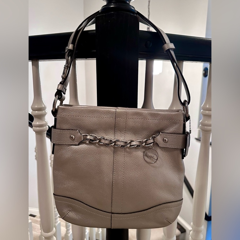 Coach, Crossbody/Shoulder Bag. Platinum in color, blush pink lining. Used once!